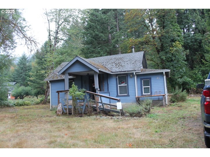 21620 Glaze Road Veneta, OR 97487 - Photo 19 of 36 a view of a house with a yard chairs and table