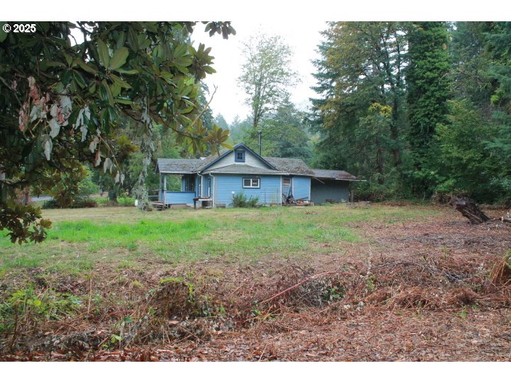 21620 Glaze Road Veneta, OR 97487 - Photo 20 of 36 a view of a house with yard and a tree