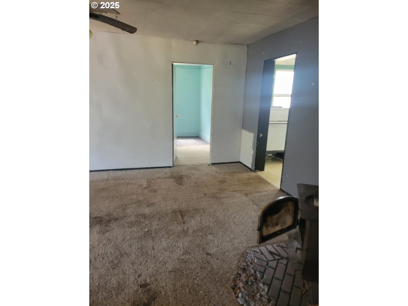 21620 Glaze Road Veneta, OR 97487 - Photo 36 of 36 a bedroom with a bed and a mirror