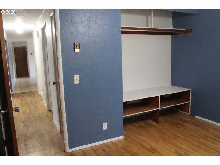 21620 Glaze Road Veneta, OR 97487 - Photo 9 of 36 a view of an empty room with wooden floor