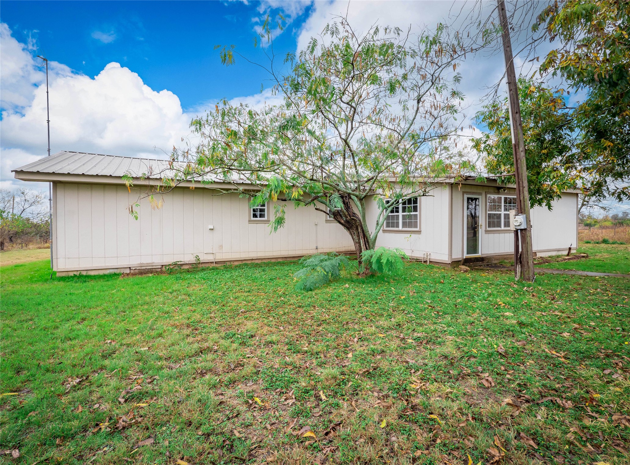 1350 County Road 414 Hamilton, TX 76531 - Photo 23 of 40 a view of a house with a yard
