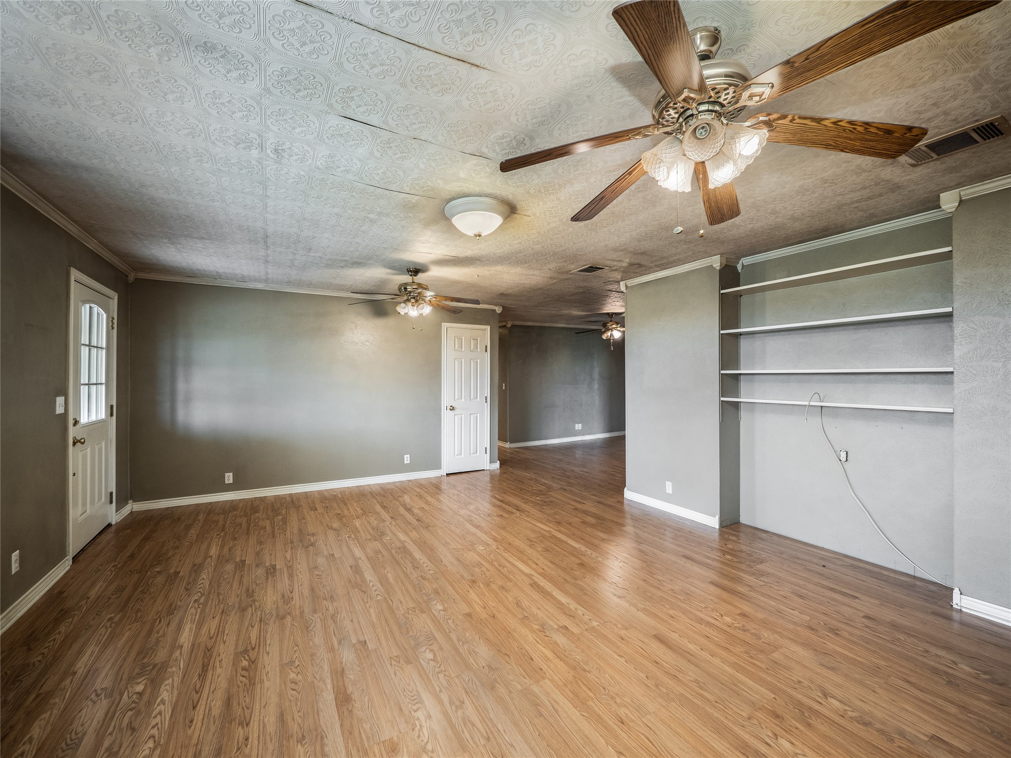 1350 County Road 414 Hamilton, TX 76531 - Photo 4 of 40 a view of empty room with wooden floor