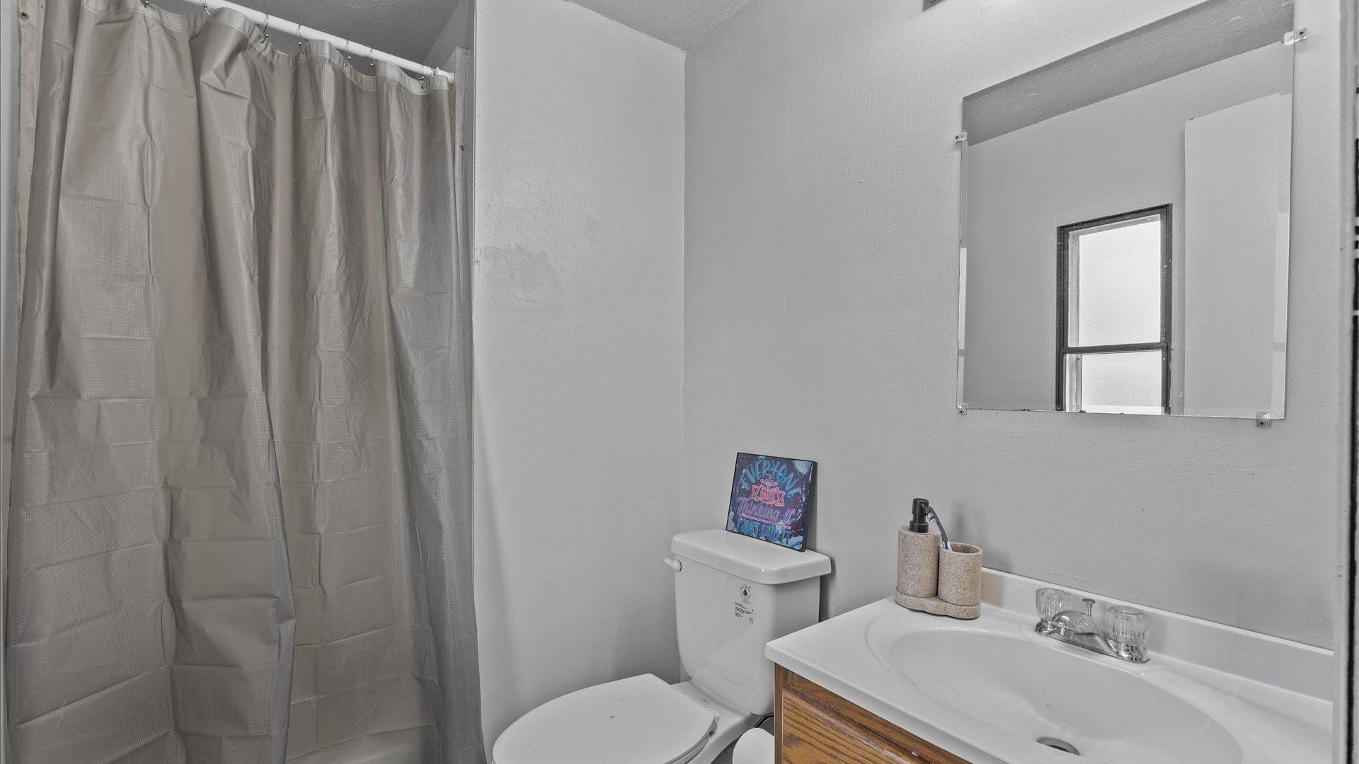 180 1/2 Southwest 8th Avenue Cedaredge, CO 81413 - Photo 13 of 18 a bathroom with a sink and a toilet