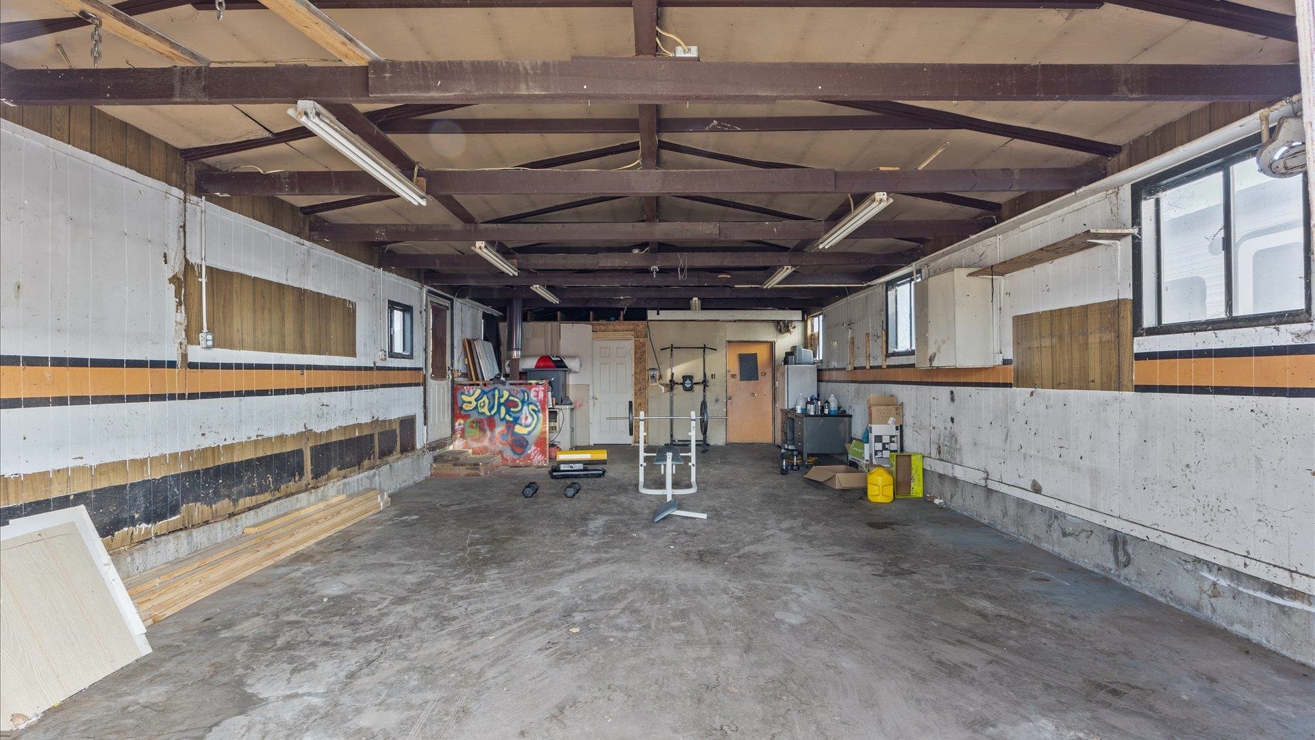180 1/2 Southwest 8th Avenue Cedaredge, CO 81413 - Photo 18 of 18 a view of a garage with wooden table and chairs