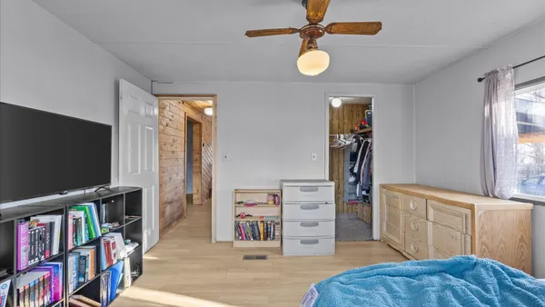 a view of a livingroom with furniture and a flat screen tv