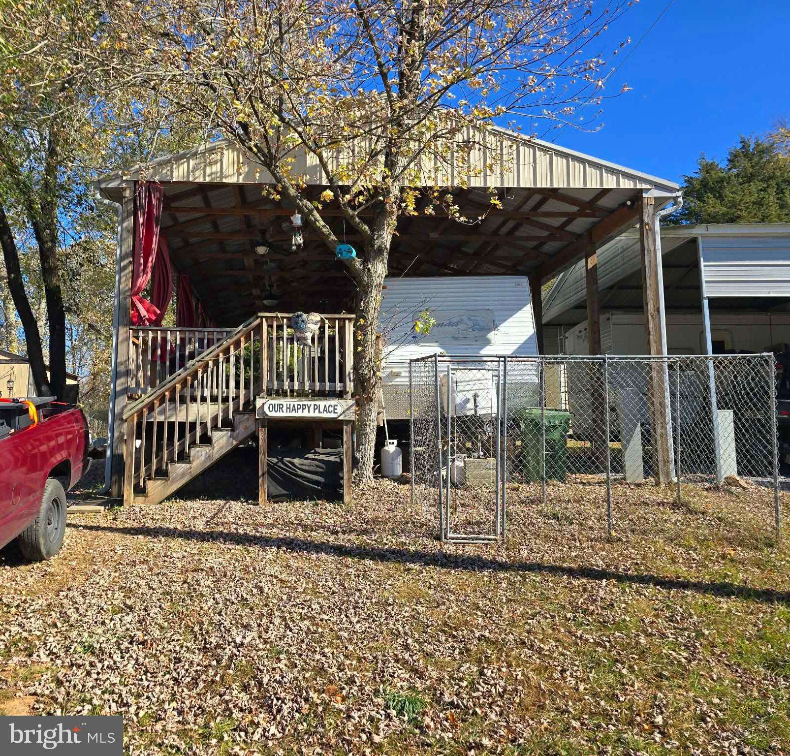 22 Rabbit Road Falling Waters, WV 25419 - Photo 2 of 8 a view of a house with a small yard and wooden fence