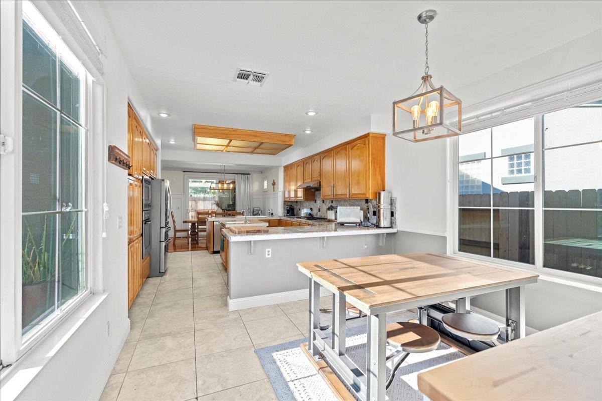 9168 Sipler Way Elk Grove, CA 95758 - Photo 16 of 35 a view of a dining room and livingroom