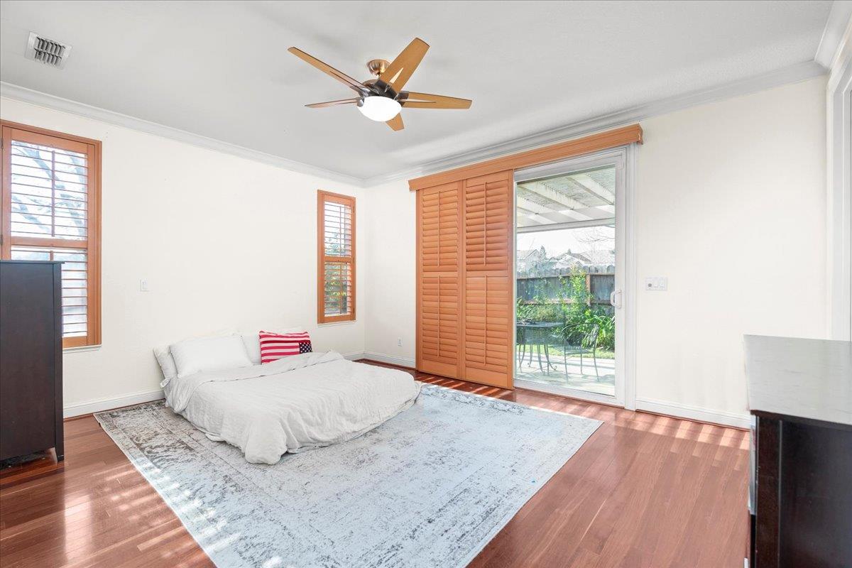 9168 Sipler Way Elk Grove, CA 95758 - Photo 18 of 35 a bedroom with a large bed and a window