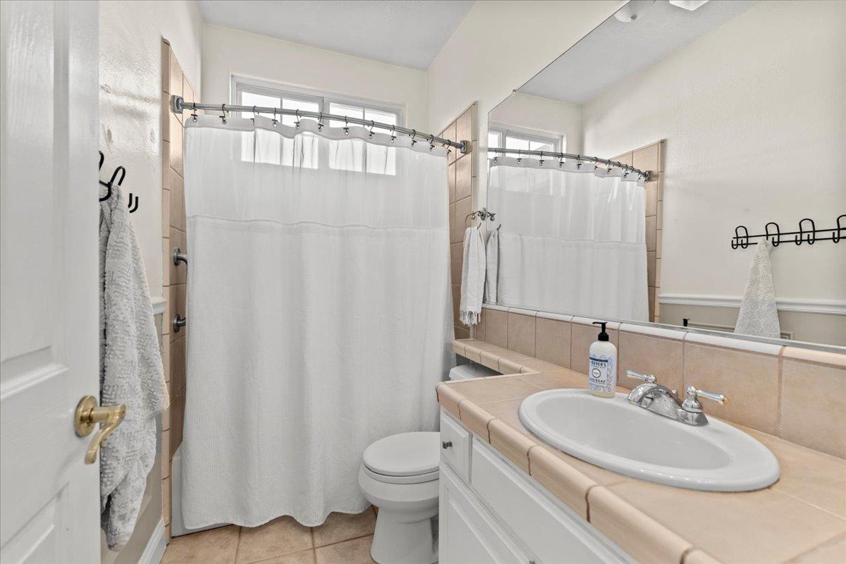 9168 Sipler Way Elk Grove, CA 95758 - Photo 24 of 35 a bathroom with a sink toilet and shower