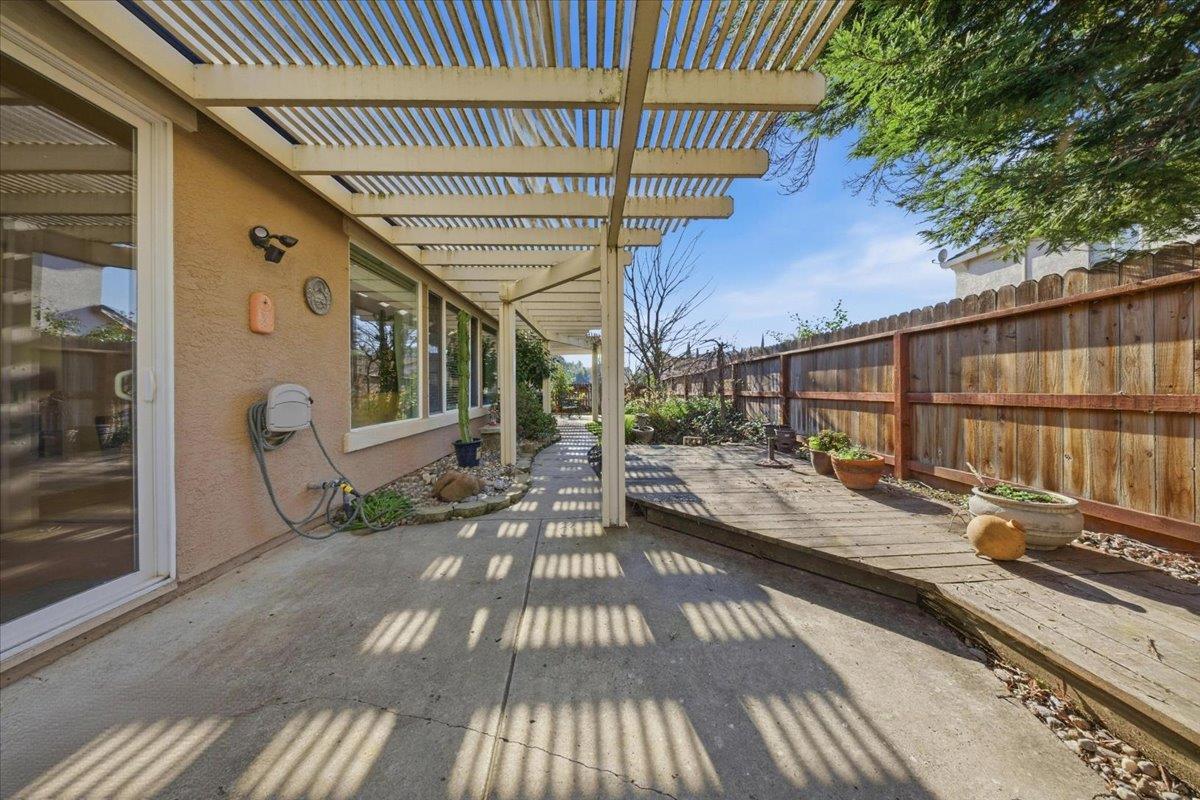 9168 Sipler Way Elk Grove, CA 95758 - Photo 28 of 35 a view of balcony with wooden floor and outdoor seating