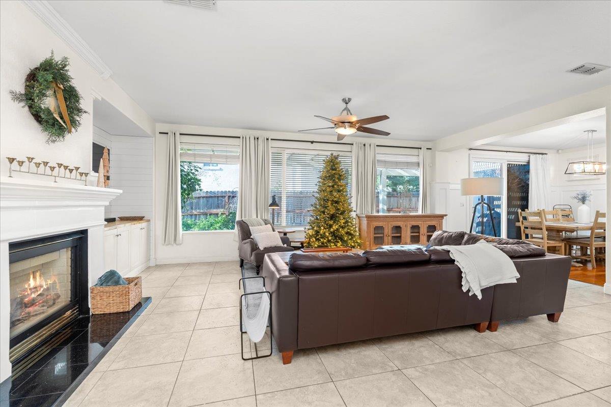 9168 Sipler Way Elk Grove, CA 95758 - Photo 7 of 35 a living room with furniture and a fireplace