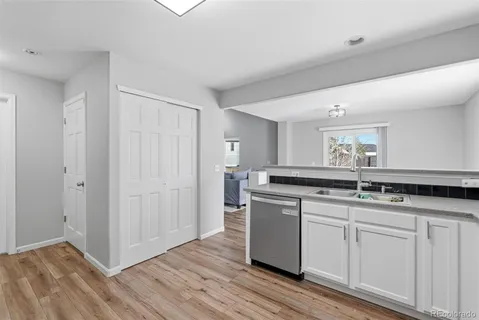a kitchen with a sink and cabinets