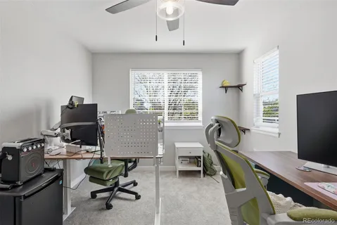 a workspace with furniture and a window