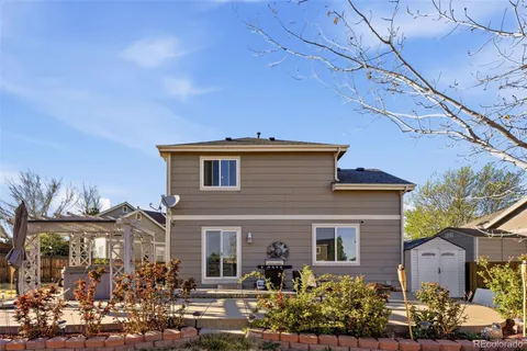a front view of a house with lots of green space