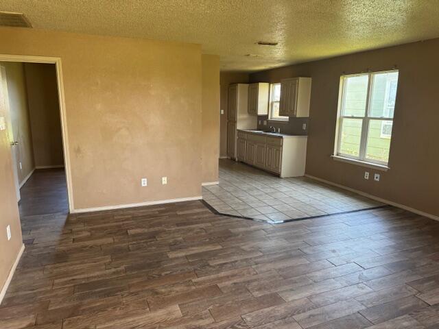 817 Ute Avenue Lubbock, TX 79403 - Photo 5 of 17 an empty room with windows and entrance