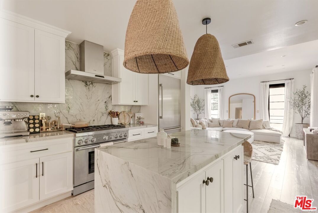 1436 Ethel Street Glendale, CA 91207 - Photo 13 of 47 a kitchen with stainless steel appliances a sink a stove and cabinets