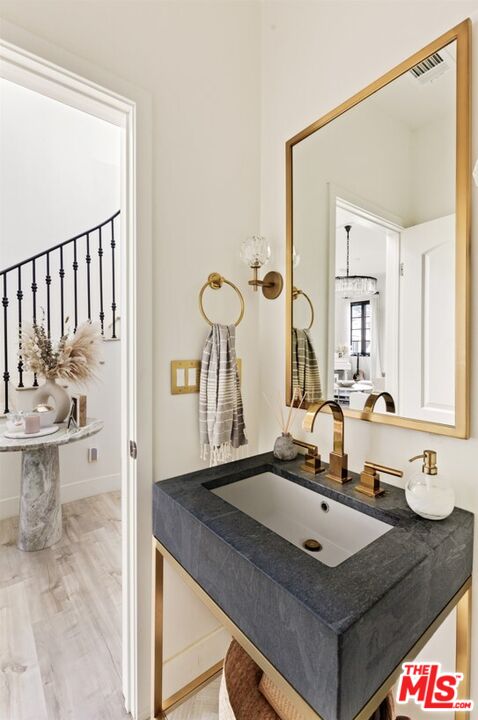 1436 Ethel Street Glendale, CA 91207 - Photo 16 of 47 a bathroom with a sink and a mirror