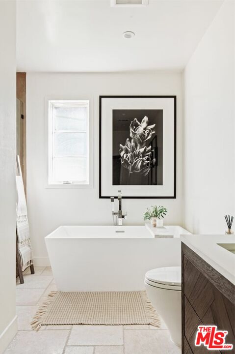 1436 Ethel Street Glendale, CA 91207 - Photo 31 of 47 a bathroom with a sink a mirror and a bathtub