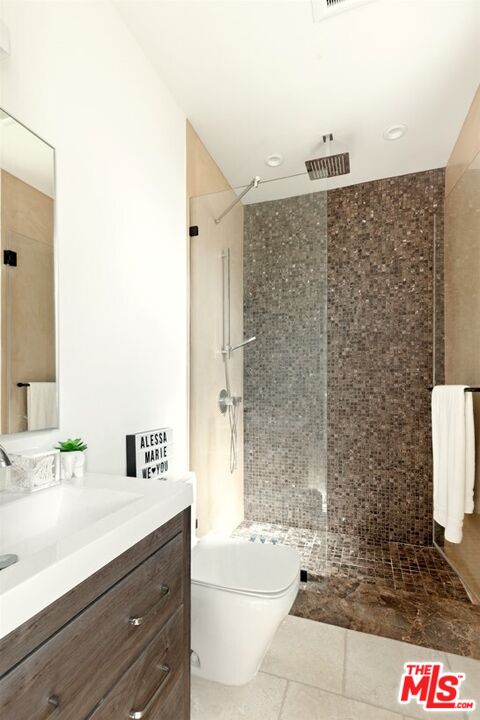 1436 Ethel Street Glendale, CA 91207 - Photo 36 of 47 a bathroom with a granite countertop sink a toilet and shower