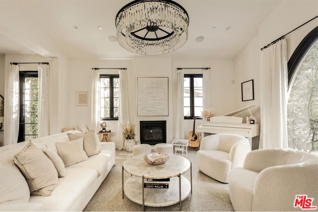 1436 Ethel Street Glendale, CA 91207 - Photo 5 of 47 a living room with furniture a fireplace and a large window
