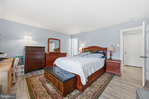 a bed room with a bed and a dresser