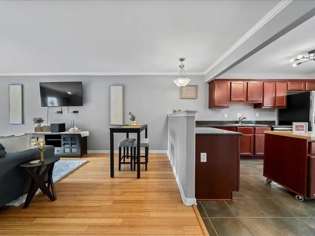 a view of a backyard with wooden fence