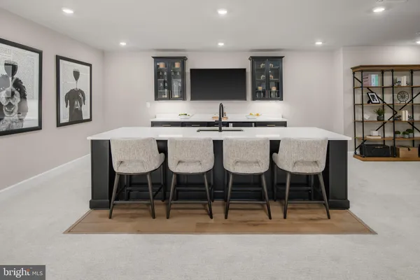 a kitchen with stainless steel appliances kitchen island granite countertop a dining table chairs and view living room