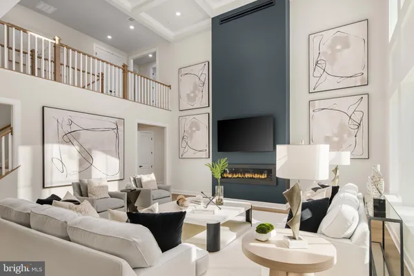 a living room with furniture a large mirror and a flat screen tv