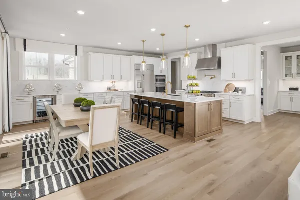 a large kitchen with lots of counter space and windows