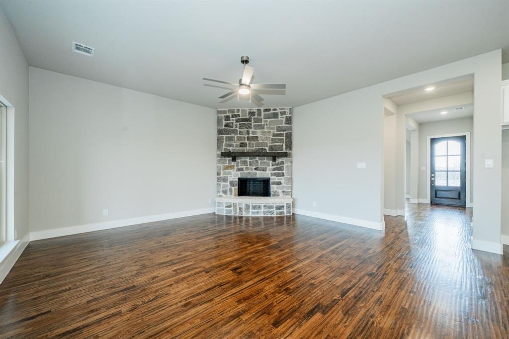424 Deer Lane Celeste, TX 75423 - Photo 11 of 40 wooden floor in an empty room with a window
