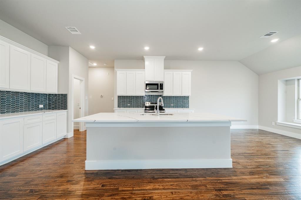 424 Deer Lane Celeste, TX 75423 - Photo 15 of 40 a view of kitchen with stainless steel appliances granite countertop a stove a sink and a refrigerator