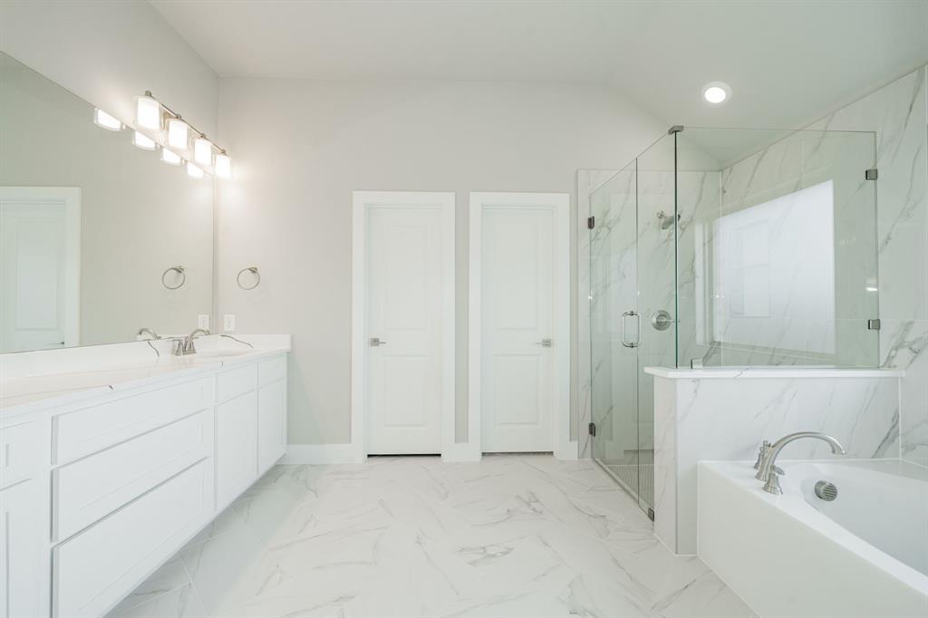 424 Deer Lane Celeste, TX 75423 - Photo 25 of 40 a bathroom with a double vanity sink mirror and shower