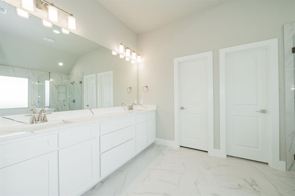 424 Deer Lane Celeste, TX 75423 - Photo 26 of 40 a bathroom with a double vanity sink mirror and