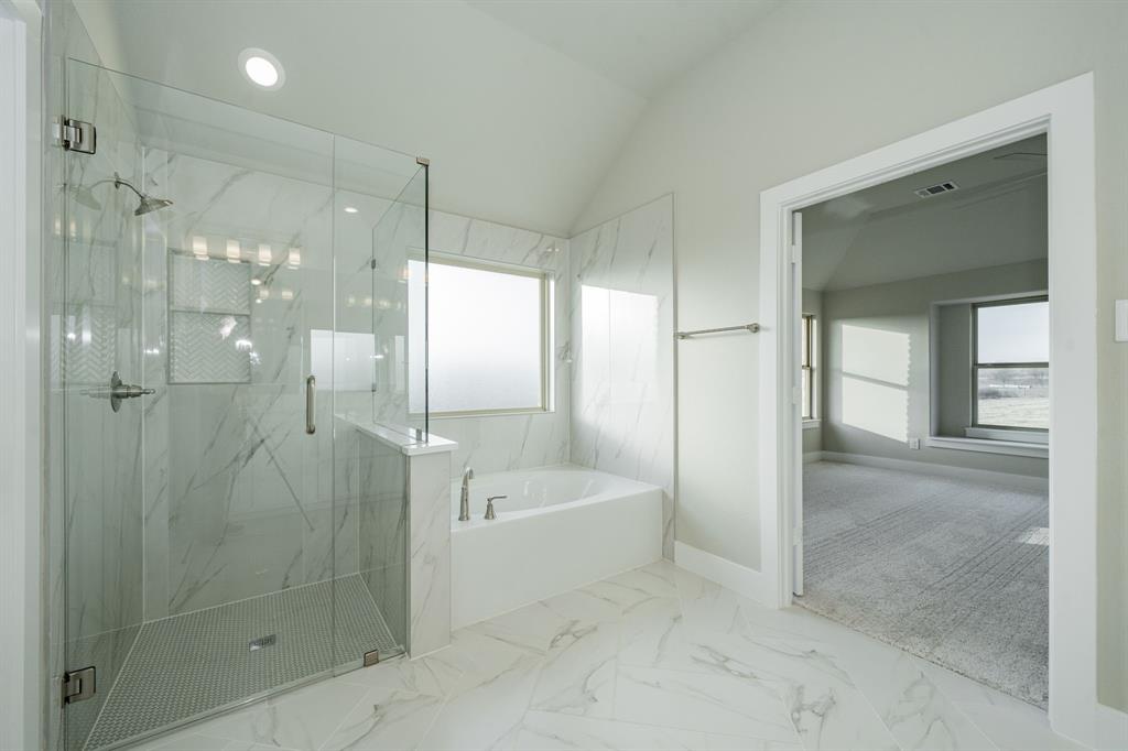 424 Deer Lane Celeste, TX 75423 - Photo 27 of 40 a bathroom with a bathtub shower and a sink