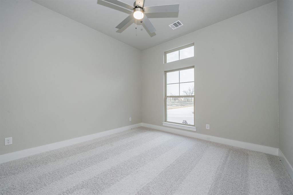 424 Deer Lane Celeste, TX 75423 - Photo 29 of 40 an empty room with a window and a fan