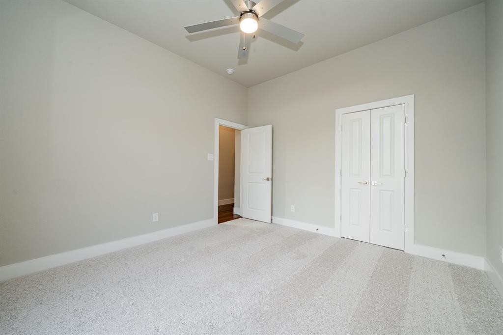424 Deer Lane Celeste, TX 75423 - Photo 30 of 40 an empty room with closet and a ceiling fan