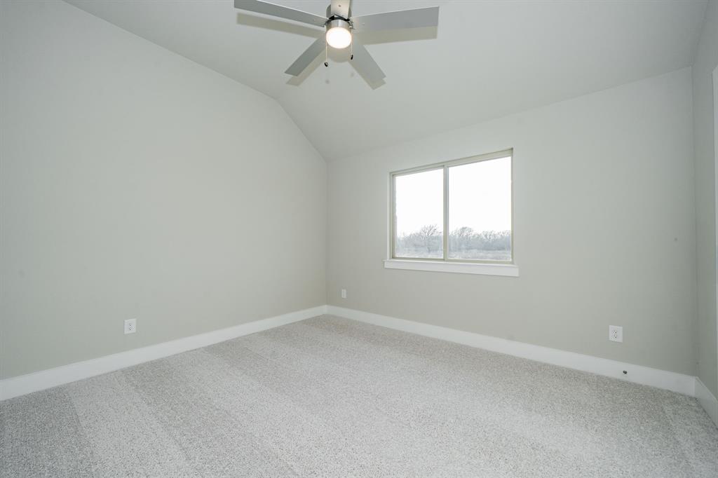424 Deer Lane Celeste, TX 75423 - Photo 31 of 40 an empty room with a window and a fan
