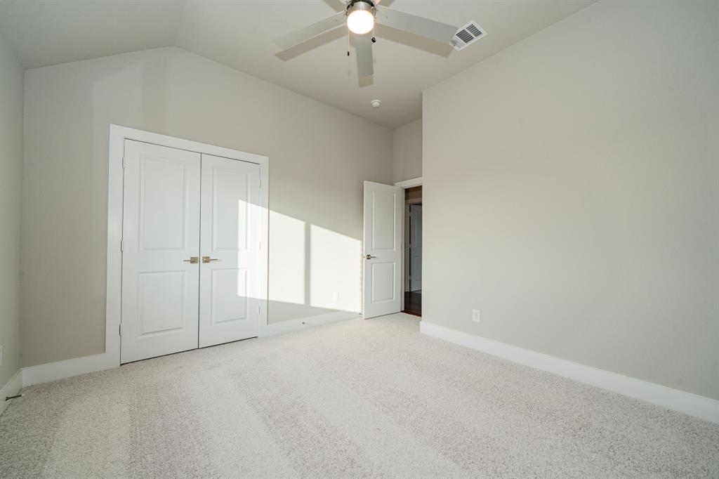 424 Deer Lane Celeste, TX 75423 - Photo 32 of 40 a view of an empty room with a chandelier fan