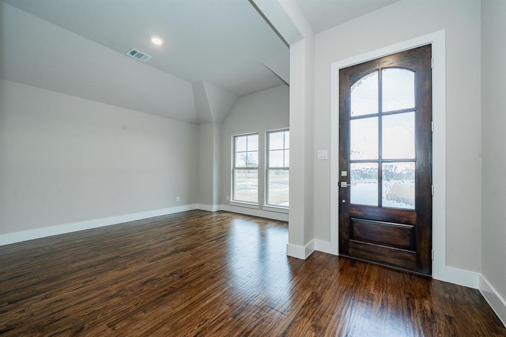424 Deer Lane Celeste, TX 75423 - Photo 5 of 40 wooden floor in an empty room with a window
