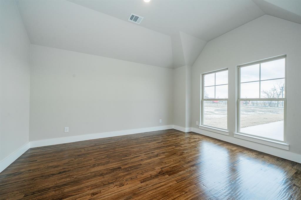424 Deer Lane Celeste, TX 75423 - Photo 6 of 40 a view of an empty room with wooden floor and a window