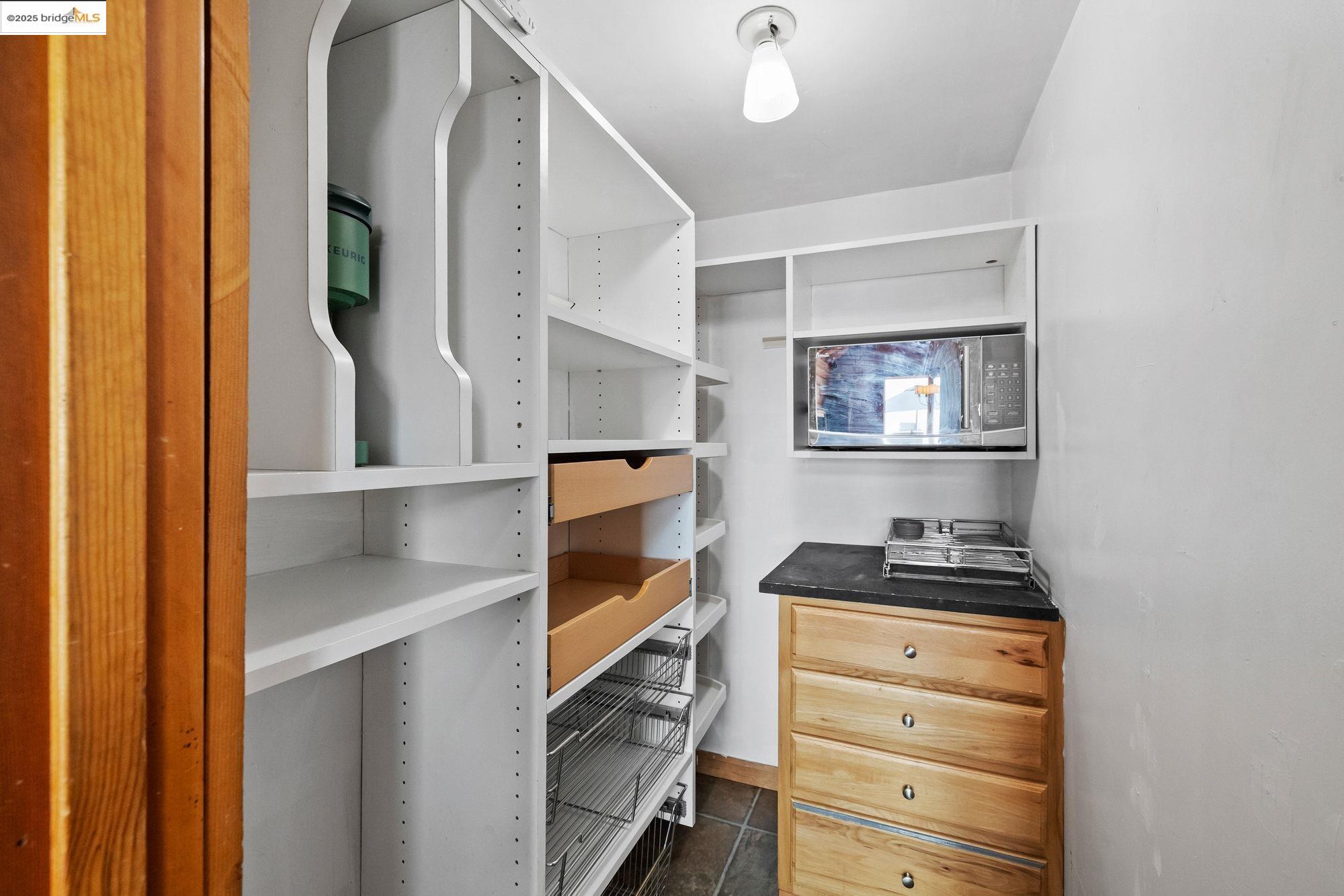 14799 Big Hill Road Sonora, CA 95370 - Photo 17 of 60 Walk in closet with dark tile patterned floors