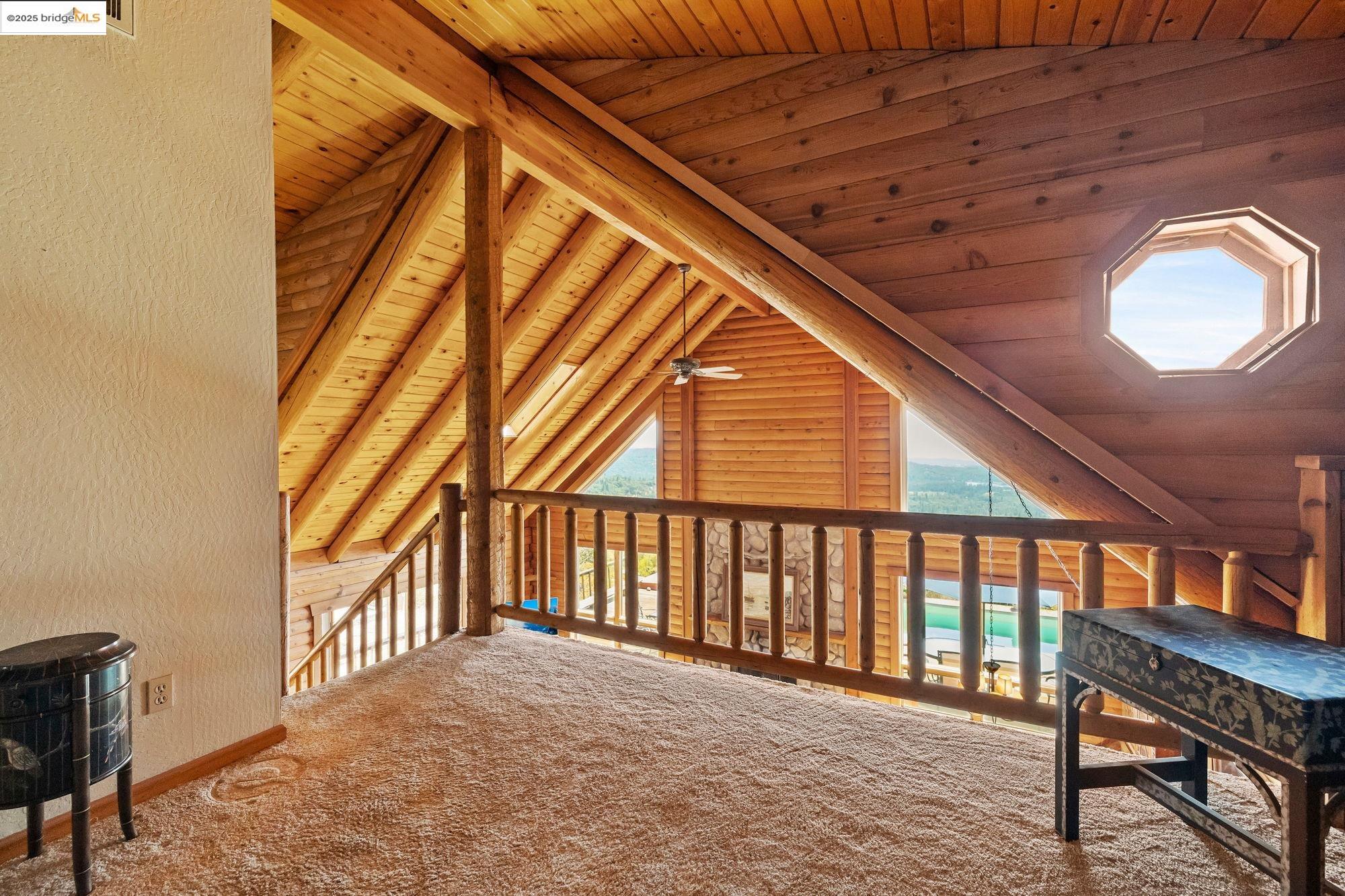 14799 Big Hill Road Sonora, CA 95370 - Photo 26 of 60 Additional living space with wooden ceiling, healthy amount of natural light, carpet floors, and a ceiling fan