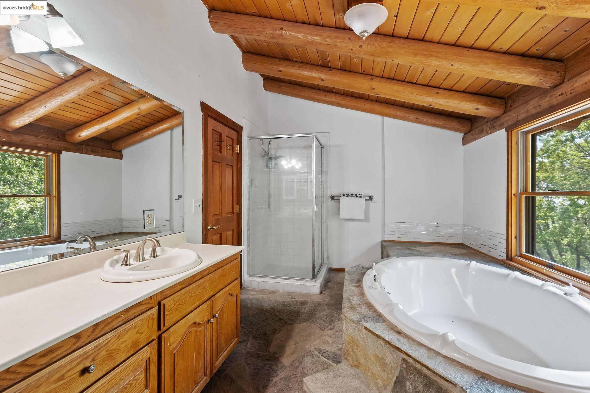 14799 Big Hill Road Sonora, CA 95370 - Photo 31 of 60 Full bath featuring wooden ceiling, vanity, a shower stall, and a bath