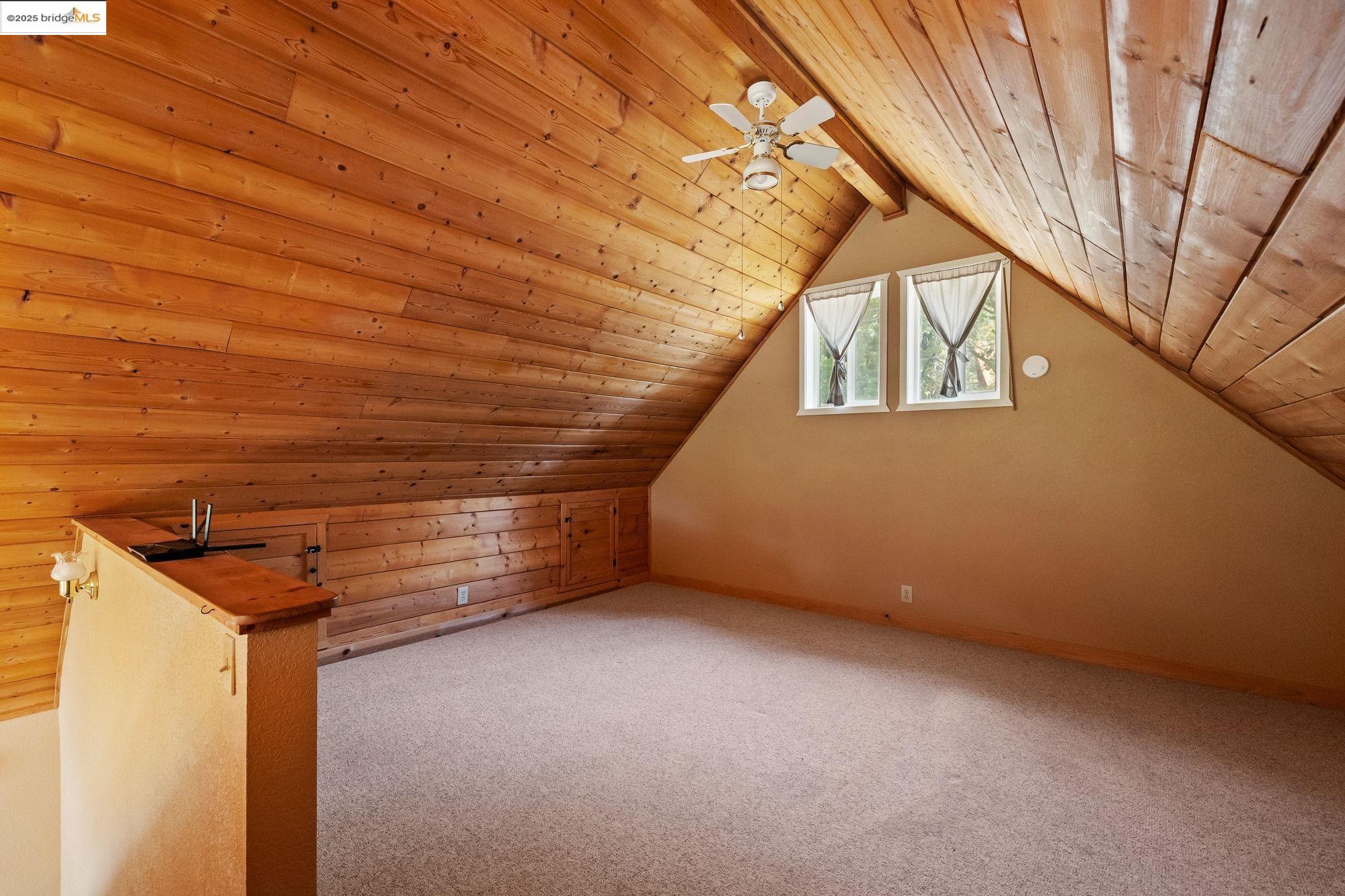 14799 Big Hill Road Sonora, CA 95370 - Photo 47 of 60 Bonus room with wood ceiling, carpet floors, and a ceiling fan