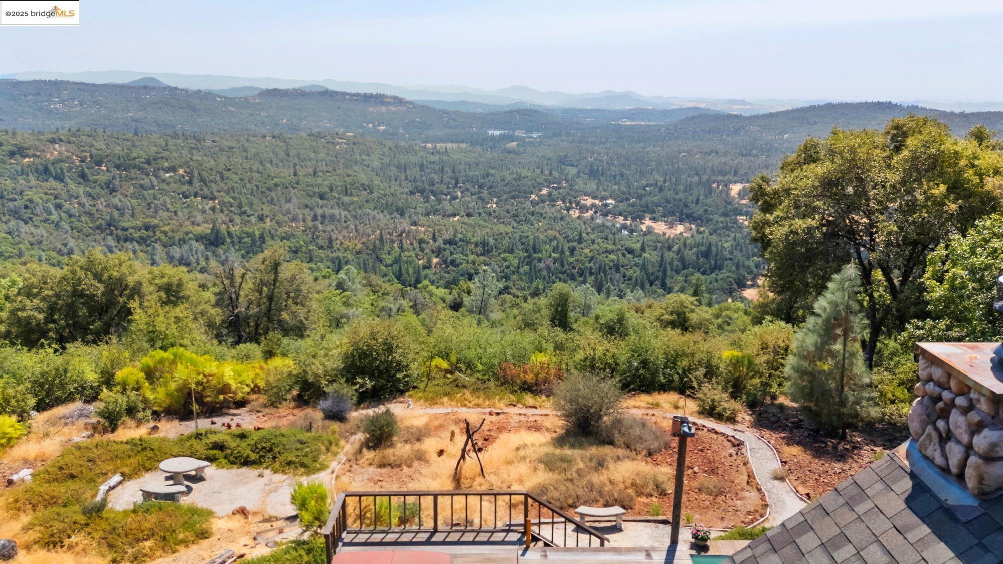 14799 Big Hill Road Sonora, CA 95370 - Photo 55 of 60 View of mountain backdrop with a forest