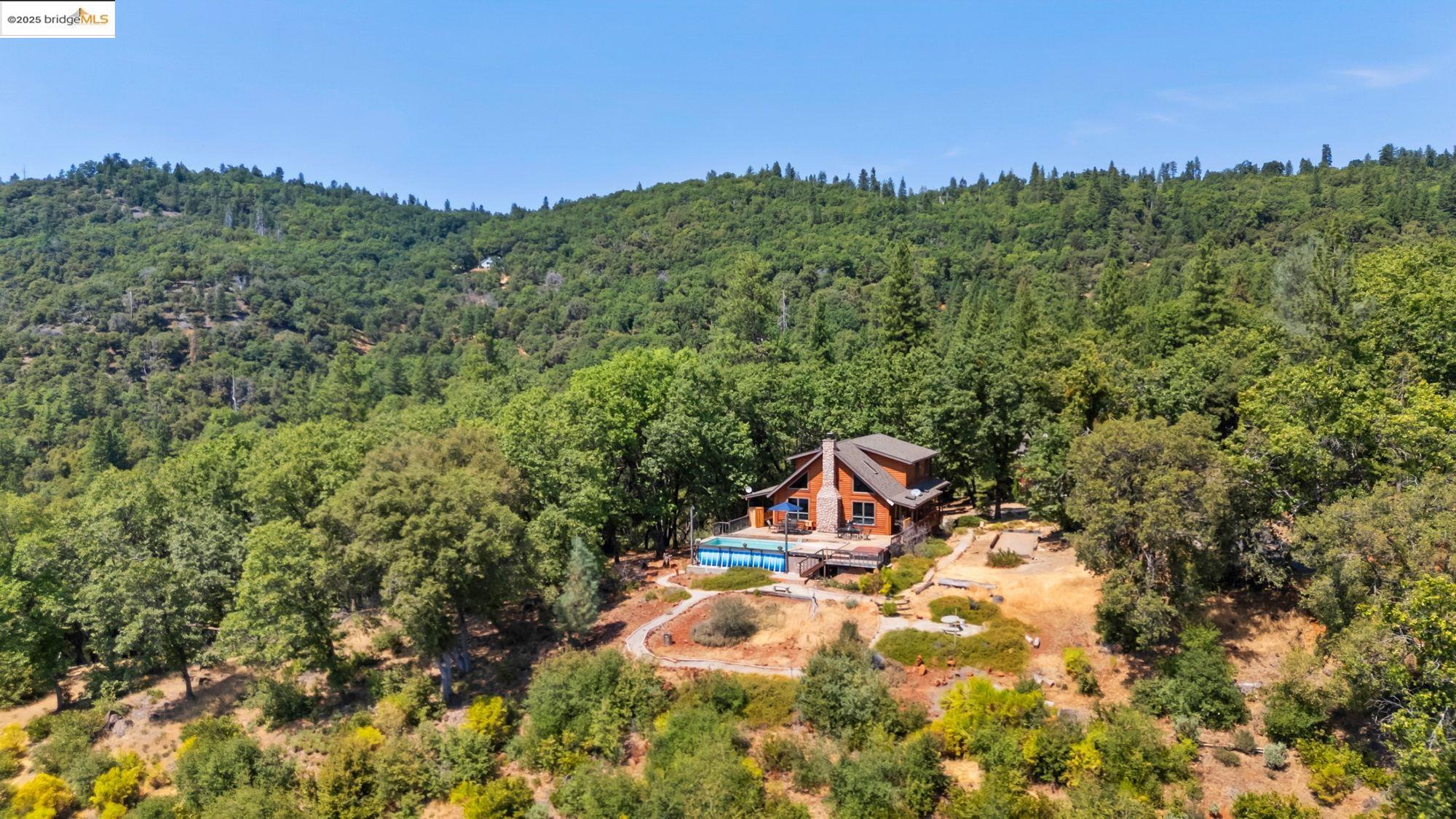 14799 Big Hill Road Sonora, CA 95370 - Photo 56 of 60 View from above of property with a forest