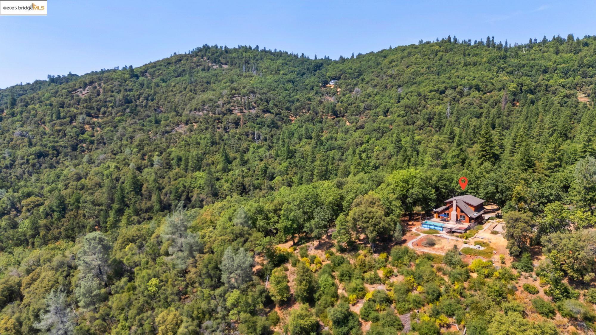 14799 Big Hill Road Sonora, CA 95370 - Photo 57 of 60 View from above of property featuring a heavily wooded area