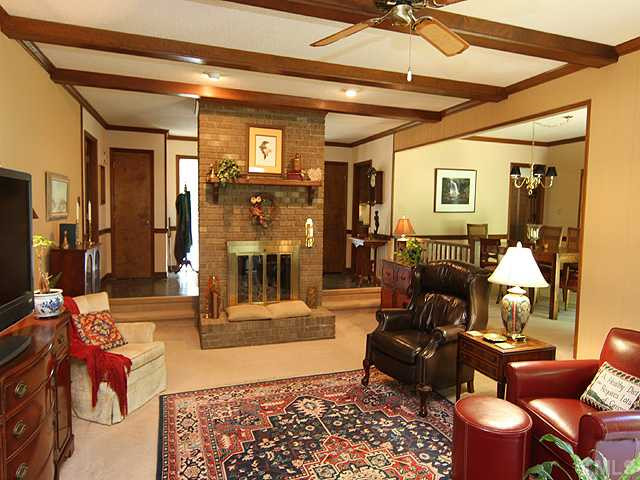 8829 Woodyhill Road Raleigh, NC 27613 - Photo 5 of 21 Very welcoming room with gas log in fireplace and has good flow to the rest of the home. Living Room