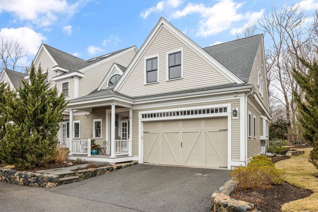 a view of a white house with a large space
