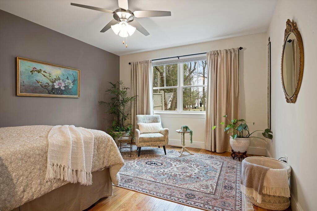 23 Courtyard Place, Unit 23 Lexington, MA 02420 - Photo 13 of 28 a bedroom with a bed couch and window